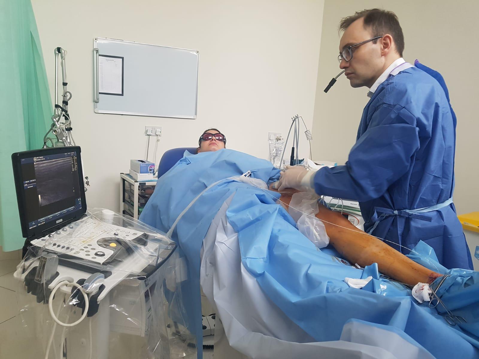 Mr Hussain performing endovenous laser ablation (EVLA) under ultrasound guidance in the procedure suite at SW11 Medical Clinic, Clapham Junction